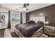 Cozy bedroom with stylish furnishings, ceiling fan and plenty of natural light from the window at 15339 N 148Th Ct, Surprise, AZ 85379