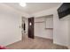Bright bedroom with light wood floors, closet, and bathroom access at 15339 N 148Th Ct, Surprise, AZ 85379