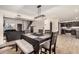Dining room with modern light fixture and adjacent living spaces at 15339 N 148Th Ct, Surprise, AZ 85379