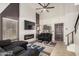 Cozy living room features a vaulted ceiling, fireplace, and modern decor at 15339 N 148Th Ct, Surprise, AZ 85379