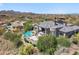 This aerial view showcases the home's in-ground pool, patio, and desert landscaping at 15427 E Firerock Country Club Dr, Fountain Hills, AZ 85268