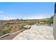 Resort-style backyard features a baja-shelf pool, fire pit, and incredible views of the surrounding desert landscape at 15427 E Firerock Country Club Dr, Fountain Hills, AZ 85268