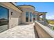 Luxury home features a large tile deck with stucco railing and views of the surrounding desert landscape at 15427 E Firerock Country Club Dr, Fountain Hills, AZ 85268