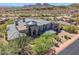Stunning home featuring desert landscaping, a tile roof, and a circular entrance with grand curb appeal at 15427 E Firerock Country Club Dr, Fountain Hills, AZ 85268
