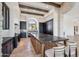 Spacious kitchen showcasing a large island with seating, stone accents, and modern appliances at 15427 E Firerock Country Club Dr, Fountain Hills, AZ 85268