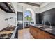 Modern kitchen boasts dark cabinetry, a stainless steel range, and a large window for natural light at 15427 E Firerock Country Club Dr, Fountain Hills, AZ 85268
