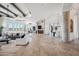 Expansive living area showcasing stone columns, wood beams, and travertine floors with an elegant decor at 15427 E Firerock Country Club Dr, Fountain Hills, AZ 85268