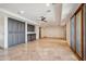 Spacious living area featuring tile floors, a ceiling fan, wet bar and sliding glass doors at 15427 E Firerock Country Club Dr, Fountain Hills, AZ 85268