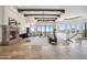 Expansive living area boasts a stone fireplace, travertine floors, and stunning mountain views at 15427 E Firerock Country Club Dr, Fountain Hills, AZ 85268