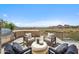 Outdoor seating area with an outside grill, luxury chairs, a table and a stunning view at 15427 E Firerock Country Club Dr, Fountain Hills, AZ 85268