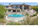 A luxurious home featuring an in-ground pool, spa, and upper and lower outdoor patios at 15427 E Firerock Country Club Dr, Fountain Hills, AZ 85268