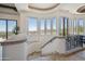 Elegant staircase with wrought iron railing and windows offering scenic mountain views at 15427 E Firerock Country Club Dr, Fountain Hills, AZ 85268