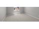 Unfurnished bedroom with neutral carpeting, natural light, and clean lines, creating a blank canvas for personalization at 15642 W Georgia Dr, Surprise, AZ 85379