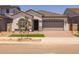 Charming single-story home featuring a two-car garage, neutral paint and tile roof at 15642 W Georgia Dr, Surprise, AZ 85379