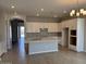 Bright open kitchen boasts an island, ample cabinet space, and modern appliances at 15642 W Georgia Dr, Surprise, AZ 85379