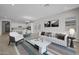 Bright, open-concept area with a modern living space, dining area, and a view of the kitchen at 15642 W Georgia Dr, Surprise, AZ 85379