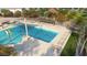 A large swimming pool at a neighborhood recreational area with lounge chairs and tables under a covered gazebo at 15642 W Georgia Dr, Surprise, AZ 85379