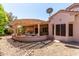 Charming backyard patio area with a covered pergola offers a cozy and inviting outdoor living space at 16240 W Talara Way, Surprise, AZ 85374