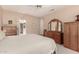 Neutral bedroom with carpet floors and standard closet and dresser at 16240 W Talara Way, Surprise, AZ 85374