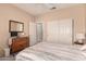 Bedroom featuring standard closet, tv on dresser, and neutral color palette at 16240 W Talara Way, Surprise, AZ 85374