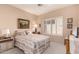 Comfortable bedroom featuring bright window, neutral colors, and carpet at 16240 W Talara Way, Surprise, AZ 85374