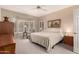 Comfortable bedroom featuring bright windows, neutral colors, and carpet at 16240 W Talara Way, Surprise, AZ 85374