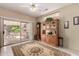 Bright dining area with sliding glass door to patio and decorative china cabinet at 16240 W Talara Way, Surprise, AZ 85374