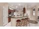 Stylish kitchen featuring bar seating at the peninsula, with views of the adjacent dining and living areas at 16240 W Talara Way, Surprise, AZ 85374