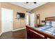 Bedroom features a TV, hardwood floors, and natural light at 16245 W Papago St, Goodyear, AZ 85338