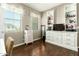 Bedroom area offering natural light from windows and a large shelving unit with storage drawers at 16245 W Papago St, Goodyear, AZ 85338