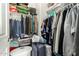 Organized closet space with shelves, hanging clothes, and various storage containers at 16245 W Papago St, Goodyear, AZ 85338
