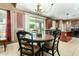 Cozy dining area with a round table, chairs, and sliding doors leading to the backyard at 16245 W Papago St, Goodyear, AZ 85338