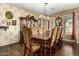 Formal dining room with ornate wallpaper and an elegant chandelier at 16245 W Papago St, Goodyear, AZ 85338