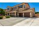 Spacious two-story home featuring a three-car garage and long driveway at 16245 W Papago St, Goodyear, AZ 85338