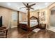 Elegant bedroom featuring a four-poster bed, wood floors, and plenty of natural light at 16245 W Papago St, Goodyear, AZ 85338