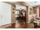 Office with hardwood floors, archway, white door, and built-in wooden shelving at 16245 W Papago St, Goodyear, AZ 85338