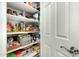Walk-in pantry with organized shelving for ample storage at 16245 W Papago St, Goodyear, AZ 85338