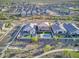 Aerial view shows properties including pools, backyard grass and desert landscaping in a well-planned community at 18381 W La Senda Dr, Surprise, AZ 85387