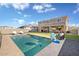 Backyard featuring a swimming pool, patio furniture and an artificial turf area at 18381 W La Senda Dr, Surprise, AZ 85387