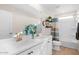 Bright bathroom with double sinks, modern fixtures, and a shower-tub combination at 18381 W La Senda Dr, Surprise, AZ 85387
