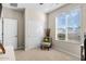 Comfortable bedroom featuring a window with blinds, closet space, and neutral-toned walls at 18381 W La Senda Dr, Surprise, AZ 85387