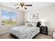 Inviting bedroom featuring a patterned bedspread and coordinated decor at 18381 W La Senda Dr, Surprise, AZ 85387