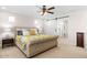 Bedroom featuring a sliding barn door to bathroom, and neutral color palette for a serene retreat at 18381 W La Senda Dr, Surprise, AZ 85387