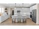 Bright kitchen featuring white cabinetry, quartz countertops, stainless steel appliances, and a large island at 18381 W La Senda Dr, Surprise, AZ 85387