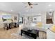 Open-concept living room with dining area and kitchen featuring modern decor and finishes at 18381 W La Senda Dr, Surprise, AZ 85387