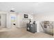 Open loft area with neutral tones, showcasing access to bedrooms and staircase at 18381 W La Senda Dr, Surprise, AZ 85387