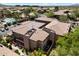 A birds-eye view of townhomes with a community pool, colorful landscaping and parking at 19777 N 76Th St # 1106, Scottsdale, AZ 85255
