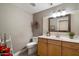 Stylish half bath with decorative mirror and neutral decor at 19777 N 76Th St # 1106, Scottsdale, AZ 85255