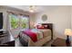 Comfortable bedroom with light walls, ceiling fan, and a large window for natural light at 19777 N 76Th St # 1106, Scottsdale, AZ 85255