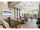 Community room with dining tables, a pool table, stylish decor, and bright natural lighting at 19777 N 76Th St # 1106, Scottsdale, AZ 85255